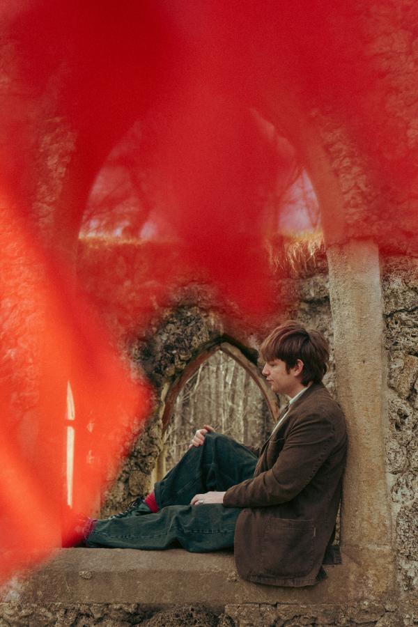 Django sitting on a windowframe