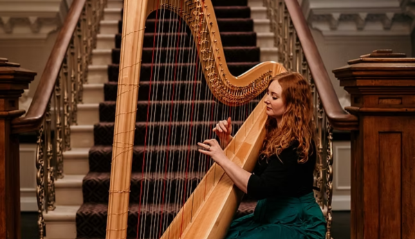 Image of woman playing a harp