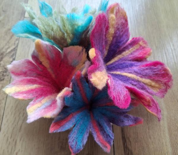 Pink flower made out of felt.