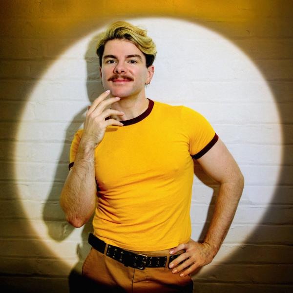 Christopher Hall in a yellow top