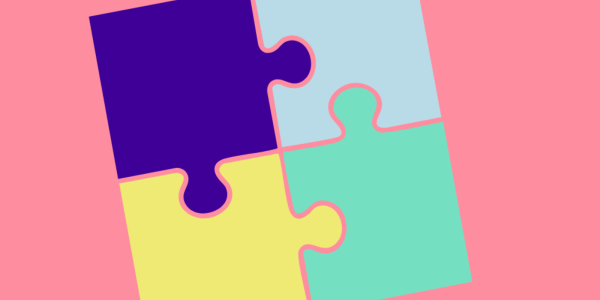 4 puzzle pieces in teal, navy, light blue and yellow on a pink background