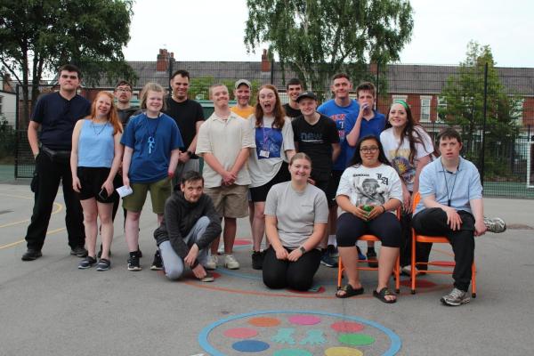 A group of happy participants posing for a picture. 