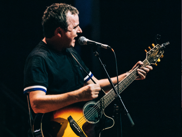 Old Red Eyes singer performing on stage.