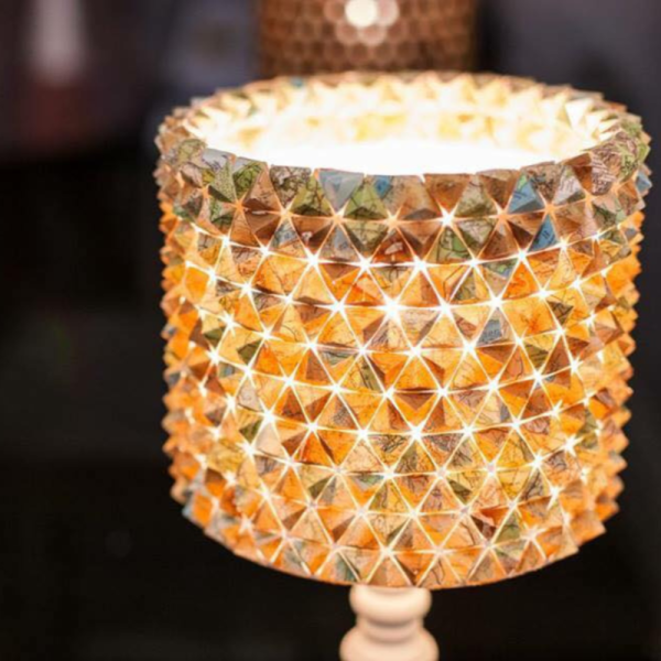 A photo of a lampshade constructed out of 3D origami triangles.
