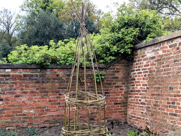 An image of a Willow Obelisk in the Walled Garden at Temple Newsam