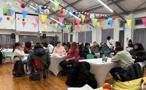 Photo showing lots of attendees in the main hall for the event