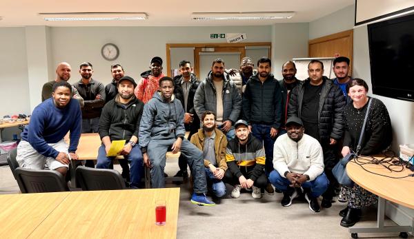 Diverse group of 18 people grouped for photo