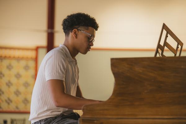 Leeds based pianist Keano Ritchie playing on the Leeds Piano Trail