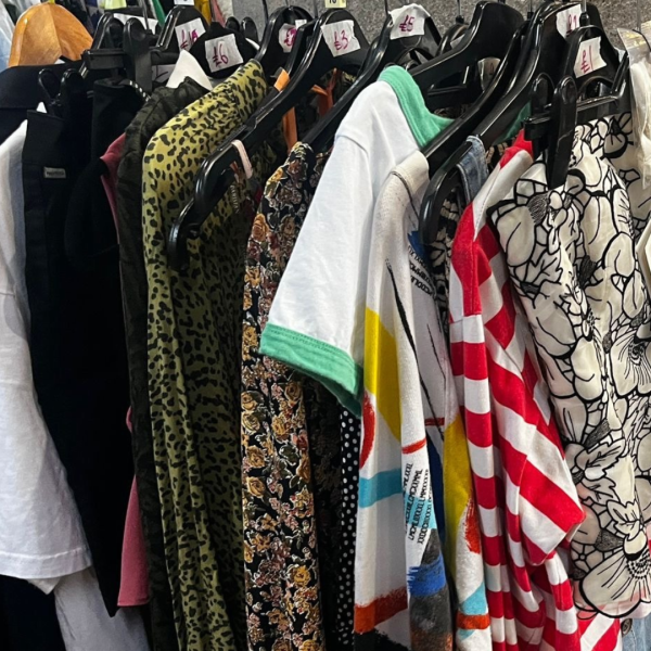 Clothes hanging on a rail.