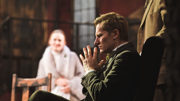 An actor performing on stage.