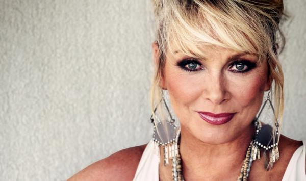 National Treasure Cheryl Baker, looking as gorgeous as ever, is giving a cheeky smile to the camera, thinking of coming to this event, definitely time to be Making Your Mind Up...