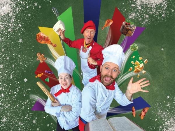 The image features three chefs in white chef uniforms and red accessories posing playfully with floating holiday food items including a turkey leg and gingerbread man, a mixer, and a very old recipe book against a festive green background with colorful geometric paper shapes. The image is framed by flour to give the effect that it has been spilled on to the image.