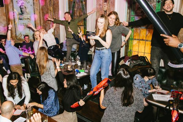 People dancing at Sounds Familiar Music Quiz