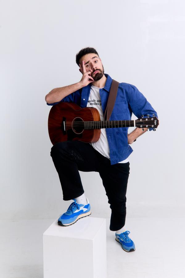 Anesti Danelis with a guitar