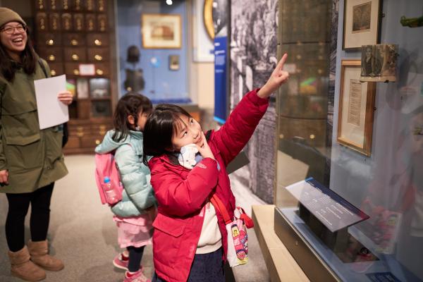 Young family exploring Leeds City Museum