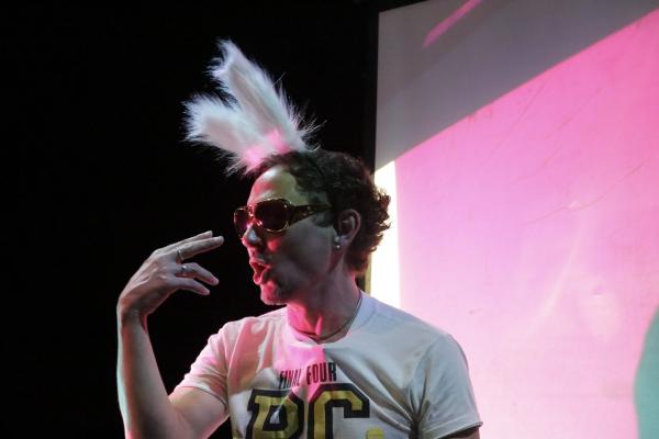 A man wearing sunglasses and rabbit ears