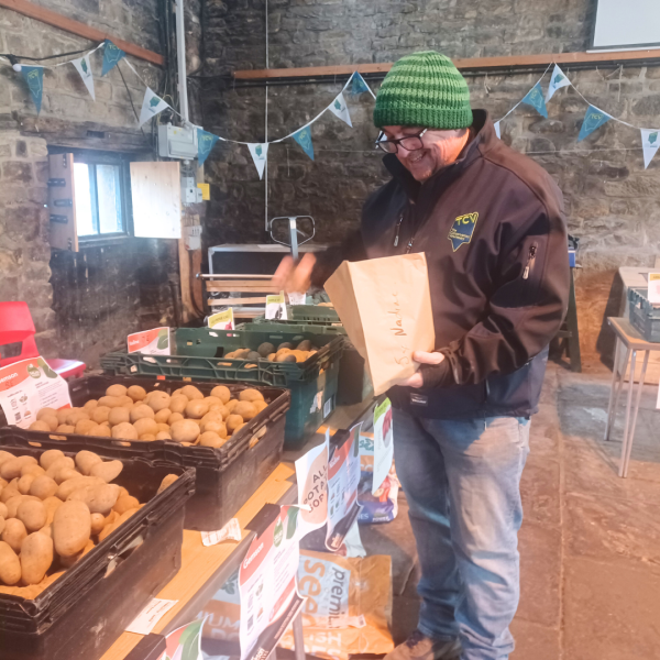 Man buying potatoes at Hollybush Potato Day 2024