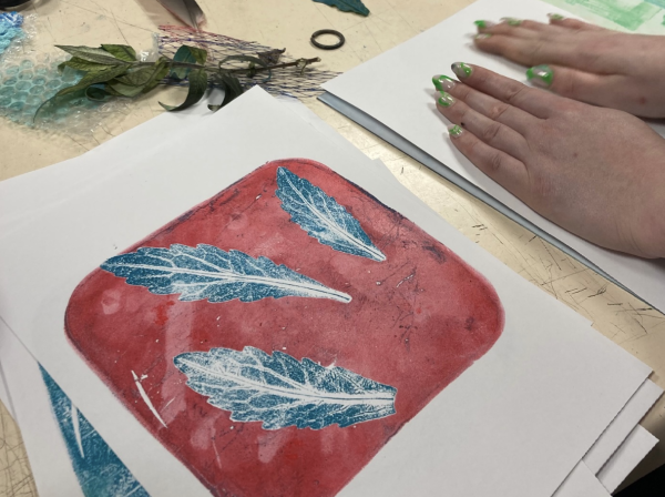 A print of blue leaves on a red background