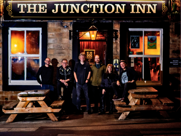 Jon Palmer Acoustic Band stood outside The Junction Inn in Otley.