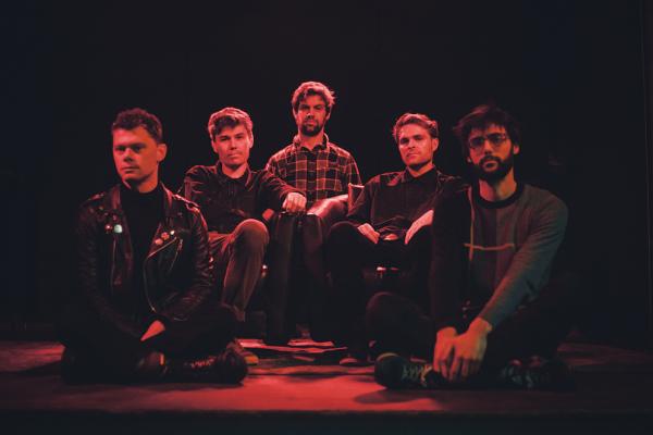 The band members of Wandering Monster - seated