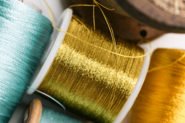 Gold and blue reels of thread