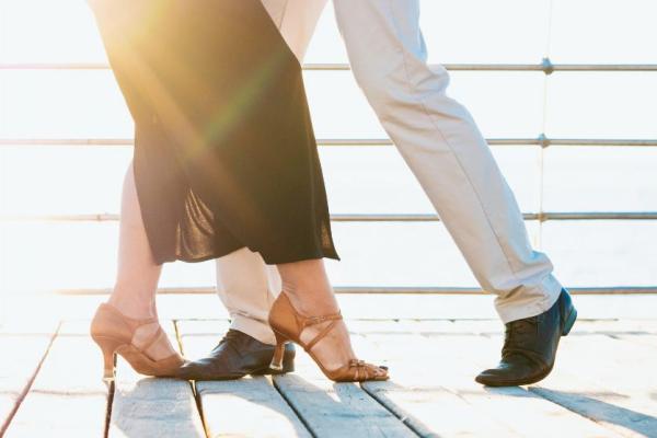 Two people salsa dancing