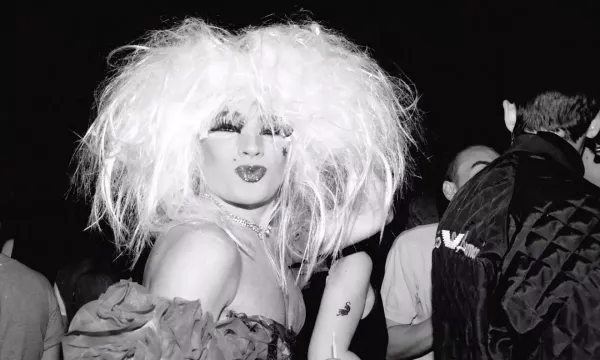 A still from the Linden Archives, of a club-goer pouting for the camera.