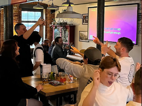 Crowd singing and dancing to karaoke at Northern Monk