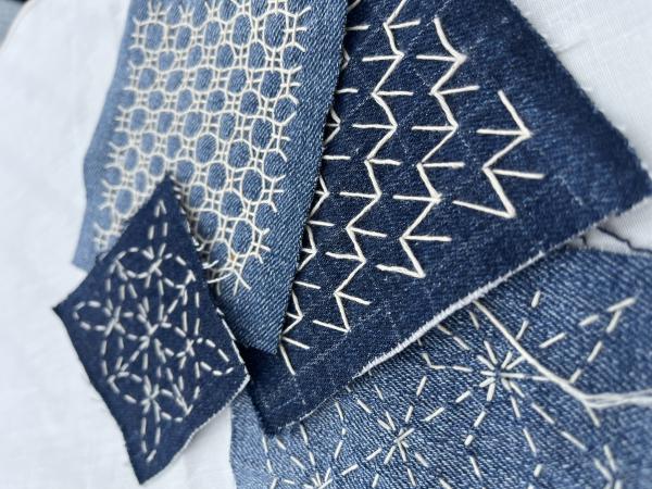 Denim material with examples of Sashiko embroidery