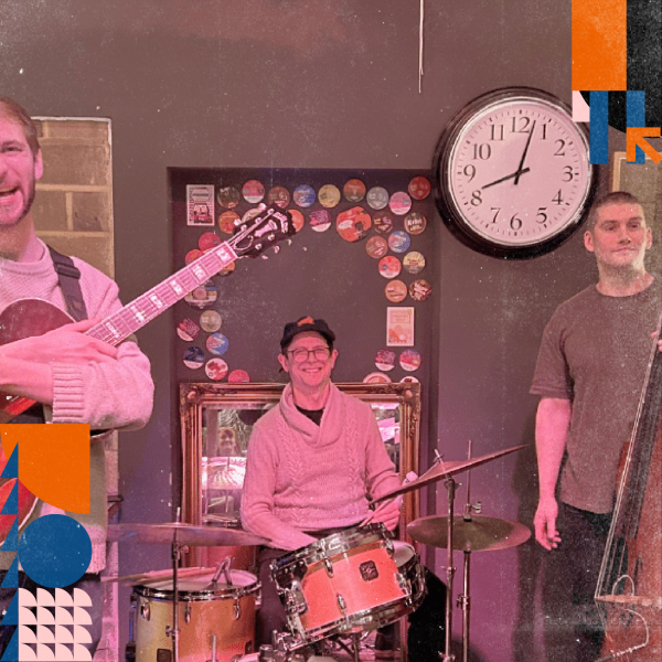 3 musicians standing with their instruments. 