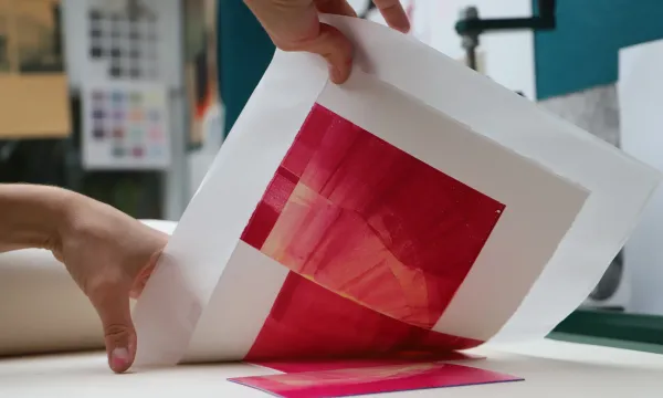 MakerSpace screen print red design and hands of maker
