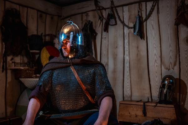 Royal Armouries actor dressed as a Saxon warrior, wearing maille and a helmet