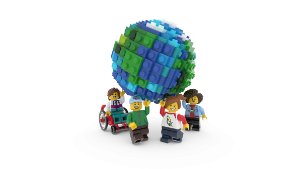 Mini LEGO figures holding up a mini LEGO earth