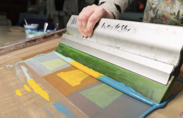 Plant pots being screen printed in blues and yellows