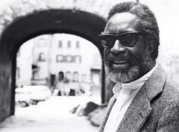 Portrait of Bill Dixon, smiling, with sunglasses