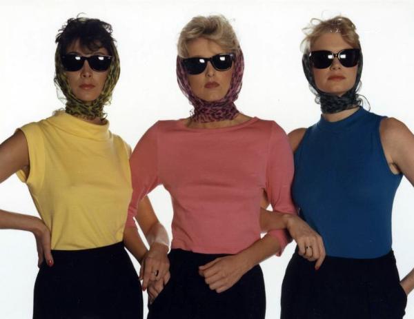 Three models wear headscarves and sunglasses