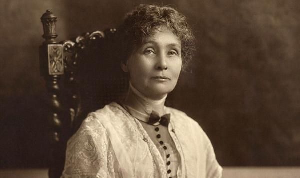Emmeline Pankhurst sits majestically in a chair