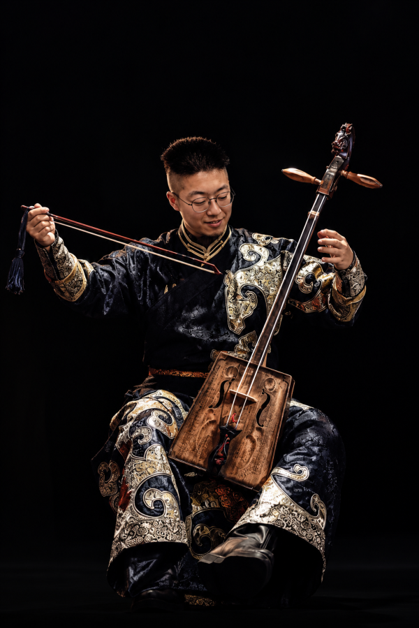 man playing traditional instrument