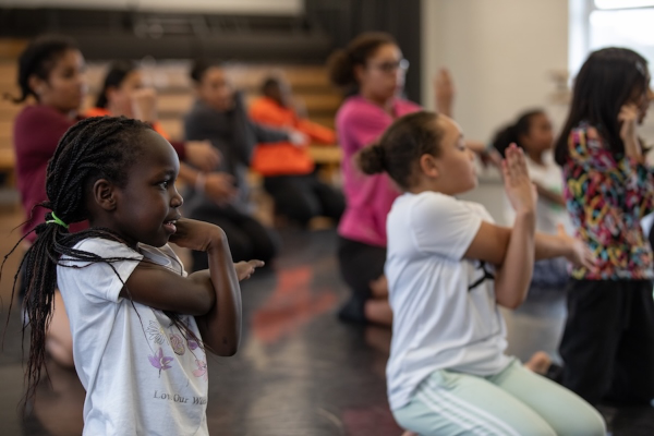 A group of young people stretching their arms