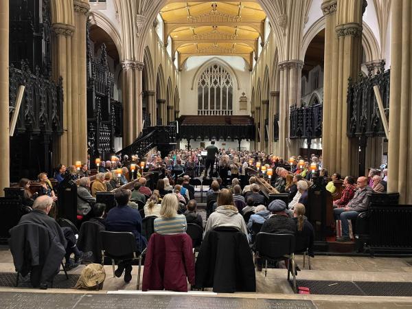 People listening to a Come and Sing performance in Leeds Minster