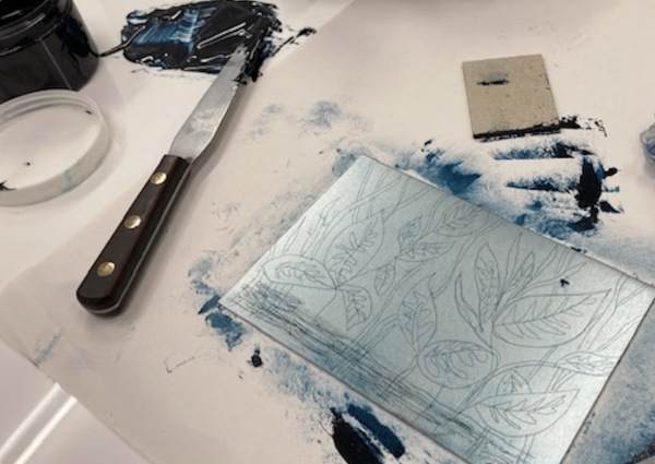 An etched design of leaves on a zinc plate ready to be printed forom