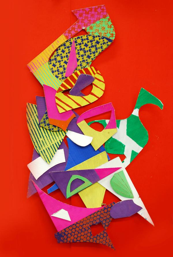 Brightly coloured paper card collage.