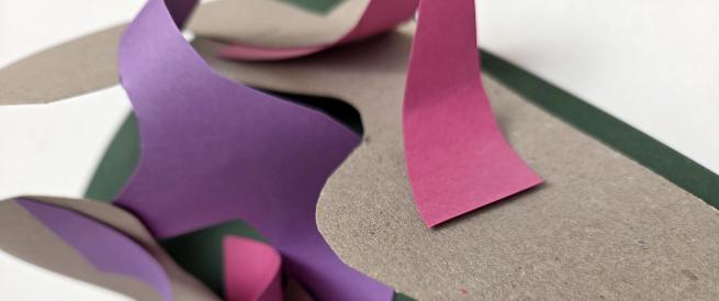 Curled and flat pieces of paper