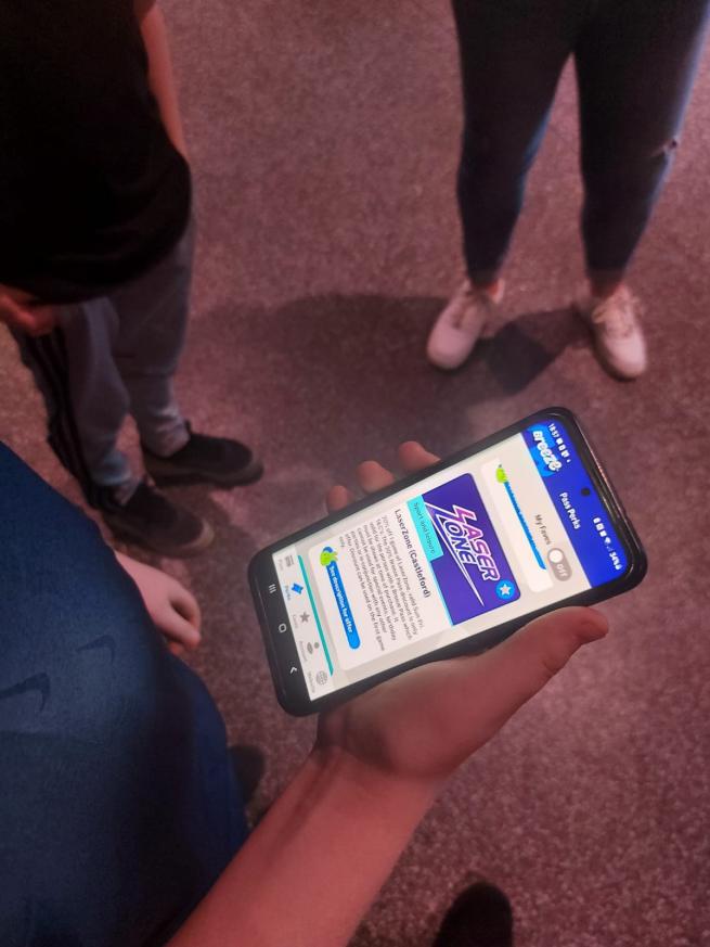 people looking at the breeze pass on a phone