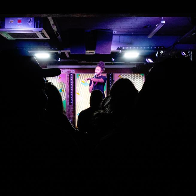 Alex Dunlop on stage at Monday Night Comedy at Headrow House