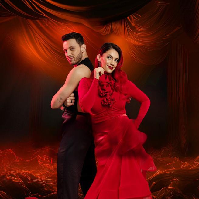 Dianne Buswell and Coppola stood back to back in flamenco-style dress against a background of orange-red draping curtains.