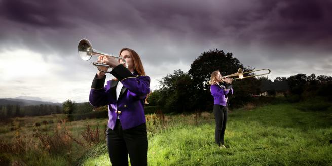 Two people playing trumpets