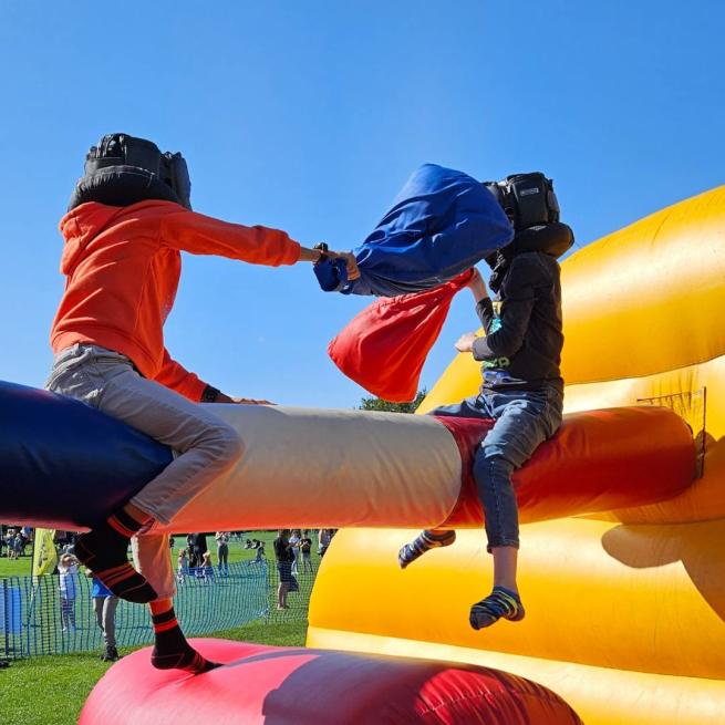 two children on inflatable