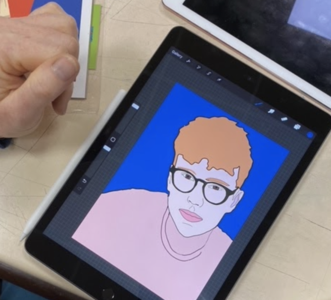 An iPad with a digital portrait of a man with ginger hair, glasses and a pink shirt
