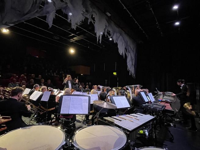 A brass band performing on the stage, 